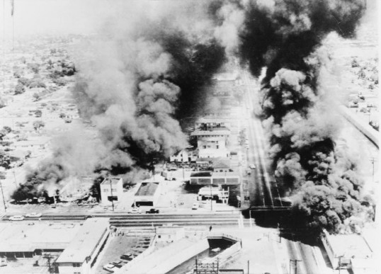 Buildings in the Watts section of Los Angeles burn in August of 1965.